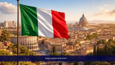 علم إيطاليا يرفرف فوق مدينة روما مع إطلالة على الكولوسيوم وكاتدرائية القديس بطرس – صورة مرافقة لمقال منح جامعة بوكوني في إيطاليا.