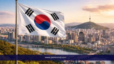 علم كوريا الجنوبية يرفرف فوق مدينة سيول مع إطلالة على نهر الهان وبرج نامسان – صورة لمقال منحة الحكومة الكورية GKS للبكالوريوس.