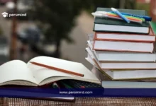 جموعة من الكتب وأقلام الدراسة تمثل فرص منح الماجستير في الدول العربية لعام 2025