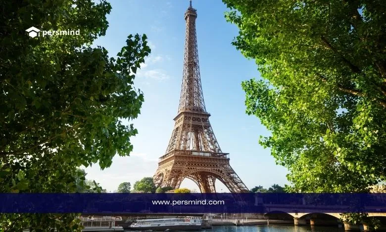 صورة لبرج إيفل في باريس بين الأشجار في يوم مشمس – تدريب الإنتربول في فرنسا 2026.