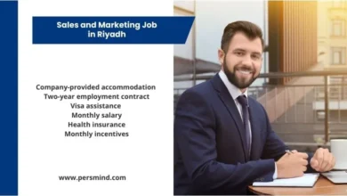 Business professional sitting at a modern office desk with an information panel highlighting benefits of a Sales and Marketing job in Riyadh.