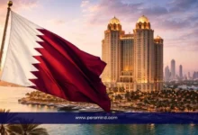 علم قطر أمام أبراج لوسيل الفاخرة في الدوحة عند الغروب – فرص توظيف في قطر