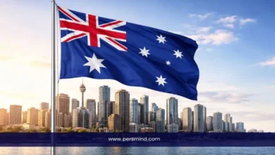 علم أستراليا يرفرف أمام أبراج مدينة سيدني في أستراليا – صورة توضيحية لمقال منحة جامعة سيدني للطلاب الدوليين.