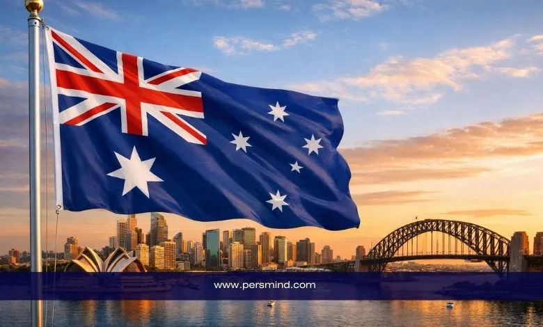 علم أستراليا يرفرف أمام معالم مدينة ملبورن وجسر سيدني عند الغروب – صورة لمقال منحة جامعة ملبورن في أستراليا