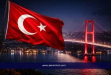 Turkish flag with Bosphorus Bridge in Istanbul at night for Joint Scholarship Program in Turkey 2026