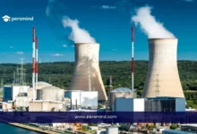 محطة طاقة نووية تحتوي على أبراج تبريد ضخمة تمثل مجال دراسة تخصص الهندسة النووية وتطبيقات الطاقة النووية