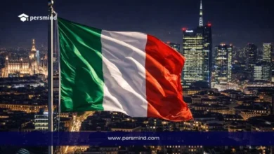 علم إيطاليا أمام أفق مدينة ميلانو ليلًا ضمن مقال عن منحة الحكومة الإيطالية MAECI للطلاب الدوليين