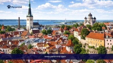 Daytime image of Tallinn, Estonia, showing historic buildings, red rooftops, church towers, and the city skyline for the Estonian Government Scholarships article.