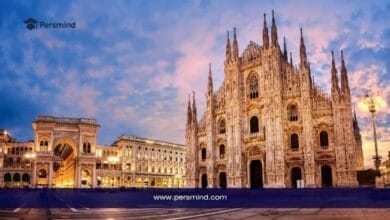 This image presents a stunning evening view of Milan, Italy, with the magnificent Duomo di Milano illuminated against the sky and surrounded by elegant historic buildings. The scene reflects the cultural richness, architectural beauty, and academic appeal of Italy, making it a suitable visual for an article about the University of Siena International Excellence Scholarship for international students.