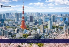 A panoramic view of Tokyo, Japan, featuring Tokyo Tower, modern skyscrapers, and cherry blossoms, used as a featured image for the Kyoto University CSEAS Fellowship article.